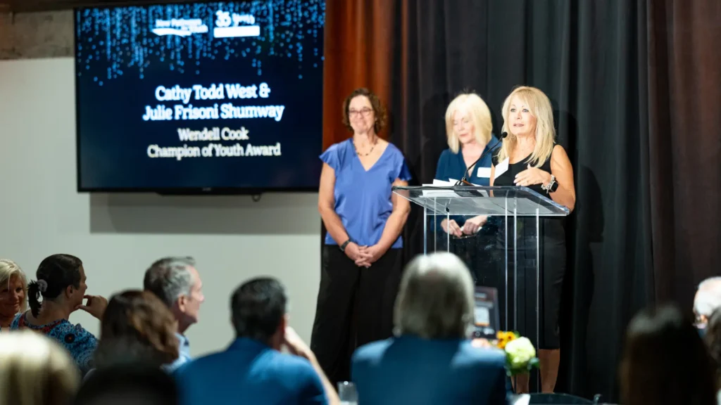 Cathy Todd West and Julie Frisoni Shumway received the Wendell Cook Champion of Youth Award